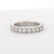 2020 This elegant ring is crafted in 18k white gold. It features a continuous row of round white diamonds, each with a G...