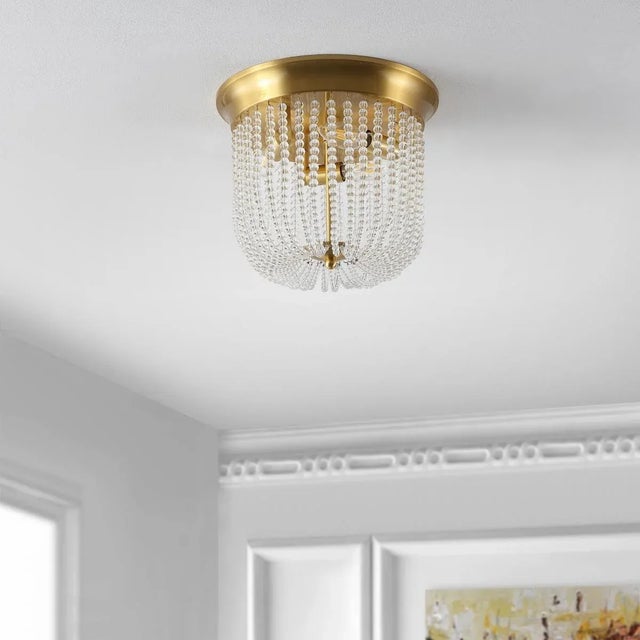Introducing the Sarella, a stunning 3 light, 12 inch gold iron flush mount that brings a touch of elegance to any space....