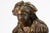 This finely cast bronze sculpture by French artist Pierre Louis Detrier depicts a woman carrying a child, rendered with...