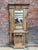 This vintage entryway coat rack made of unfinished oak has been completely restored. It features 8 brass coat hooks, a...