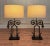 This pair of cast iron architectural relic lamps have a rustic farmhouse, French country aesthetic.. The wrought iron base...