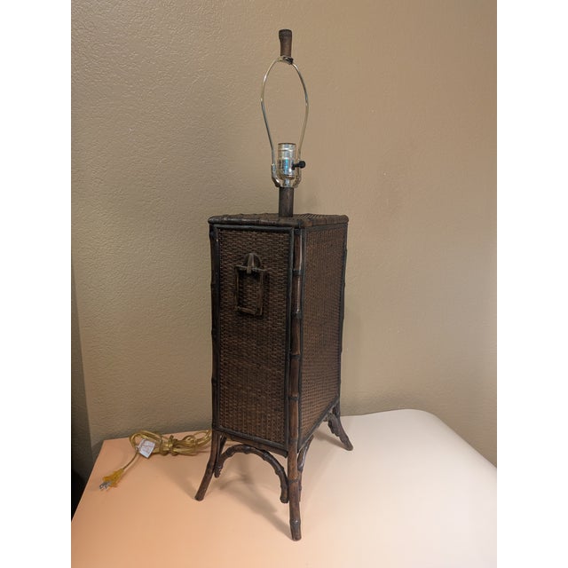 Add warmth and texture to your space with this charming vintage accent lamp featuring bamboo detailing and woven rattan...