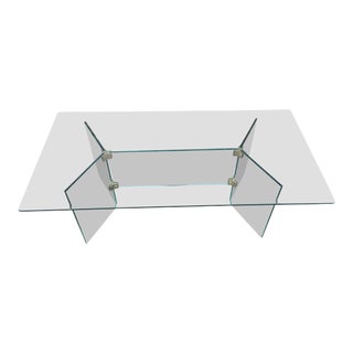 Pace glass coffee table with brass brackets For Sale