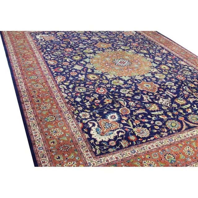 ACTUAL SIZE: 9’8″ x 12’0″ PRIMARY COLOR: Navy / Rust AGE: Old MATERIALS: Wool & Silk FOUNDATION: Cotton PRODUCTION:...