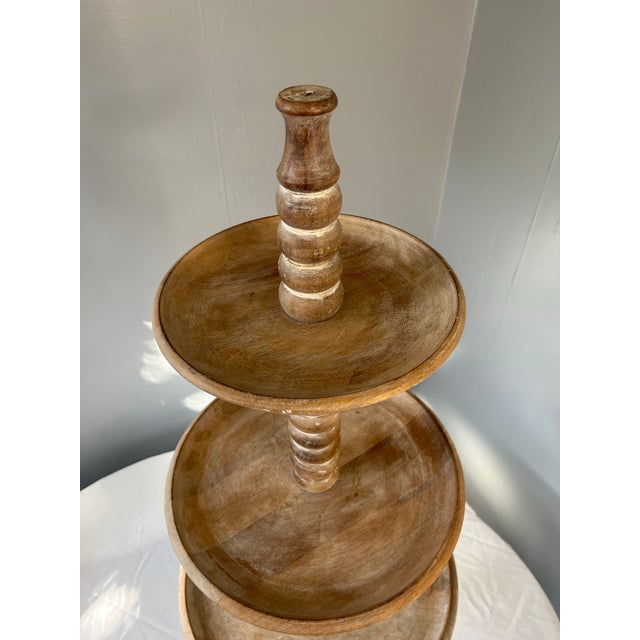 A beautifully hand-turned, French-inspired four-tier fruitwood display stand, crafted in India as a late 20th-century...