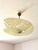 1960s saucer pendant light, gilt brass frame, asymmetrical pale yellow glass shade with transparent and green patterns....