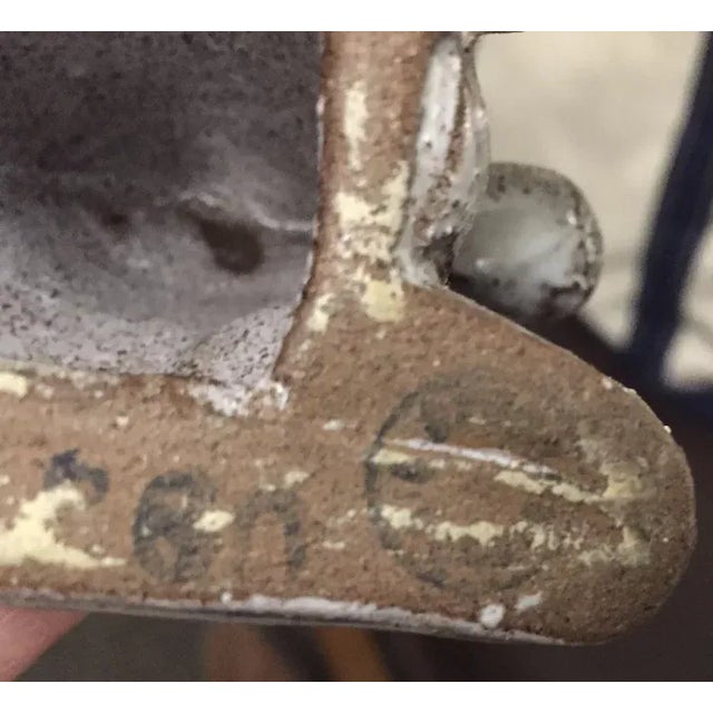 Art Deco figure of a recumbent horse with stipple glaze. Bears original paper label for F. W. New York. Additionally...