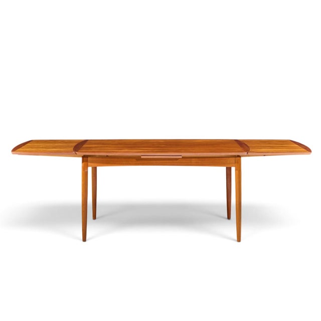 Kurt Østervig Style Mid Century Danish Teak Hidden Leaf Dining Table This table measures: 59 wide x 39.25 deep x 29.25...