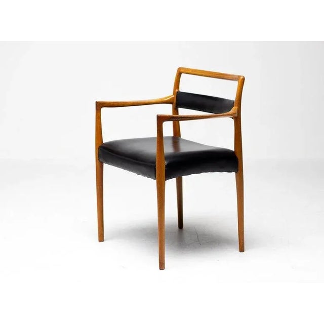 Rare matching all original set of 6 model dining chairs in beautifully sculpted teak and black leather designed by Kai...