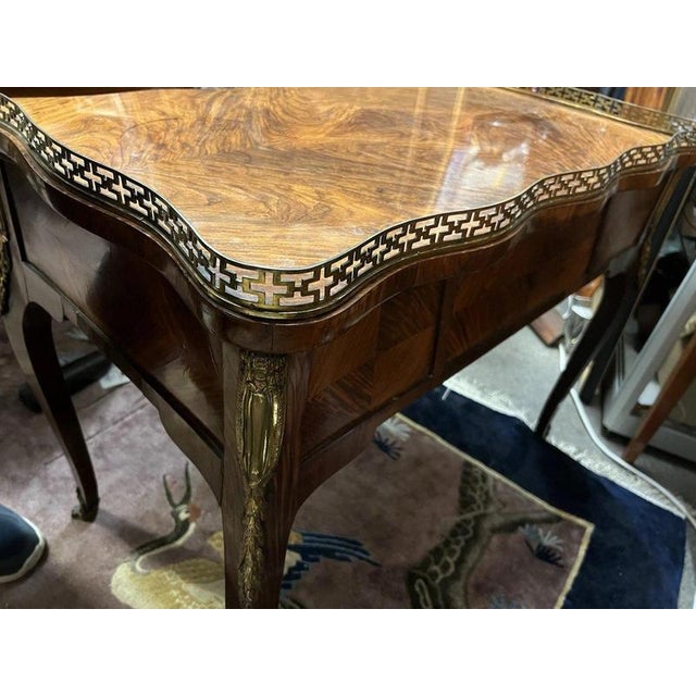 A highly unusual and decorative antique French bureau plat fitted as an oversized tea caddy, combining the proportions and...