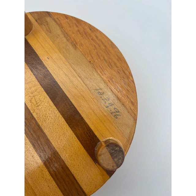 Striking vintage handcrafted lidded wood bowl dated October 24, 1996 on the underside. The piece is constructed from...