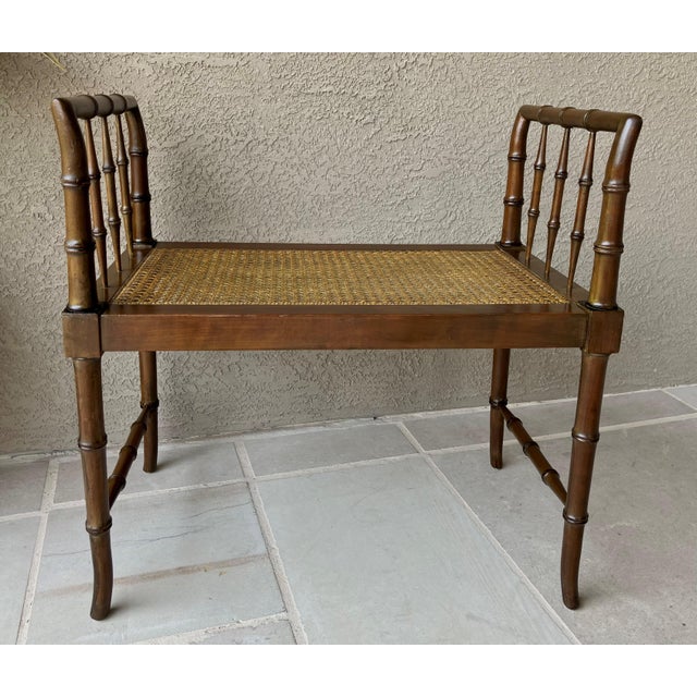 The timeless appeal of this diminutive Baker Furniture faux bamboo Chinese Chippendale window or entryway bench offers a...