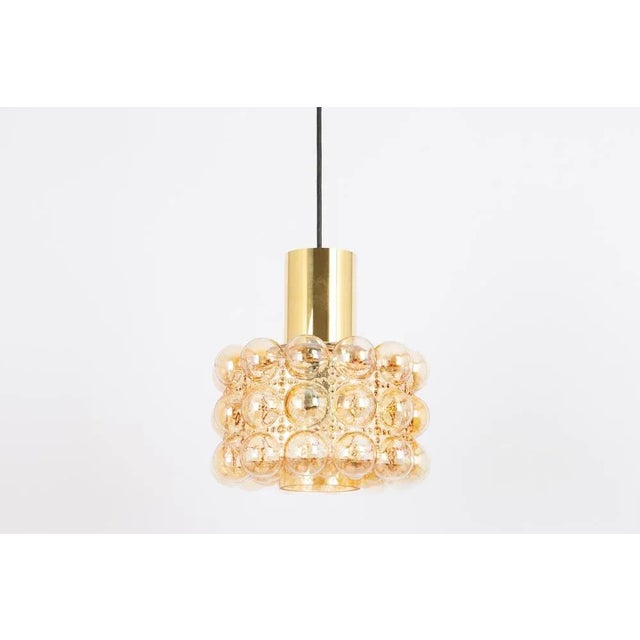 A large round with light smoke tone bubble glass pendant designed by helena tynell for limburg, manufactured in germany,...