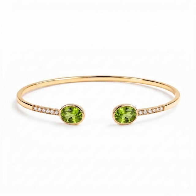 Add a touch of timeless elegance to your jewelry collection with this beautifully crafted Oval Peridot Open Cuff Bracelet....