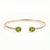 Add a touch of timeless elegance to your jewelry collection with this beautifully crafted Oval Peridot Open Cuff Bracelet....