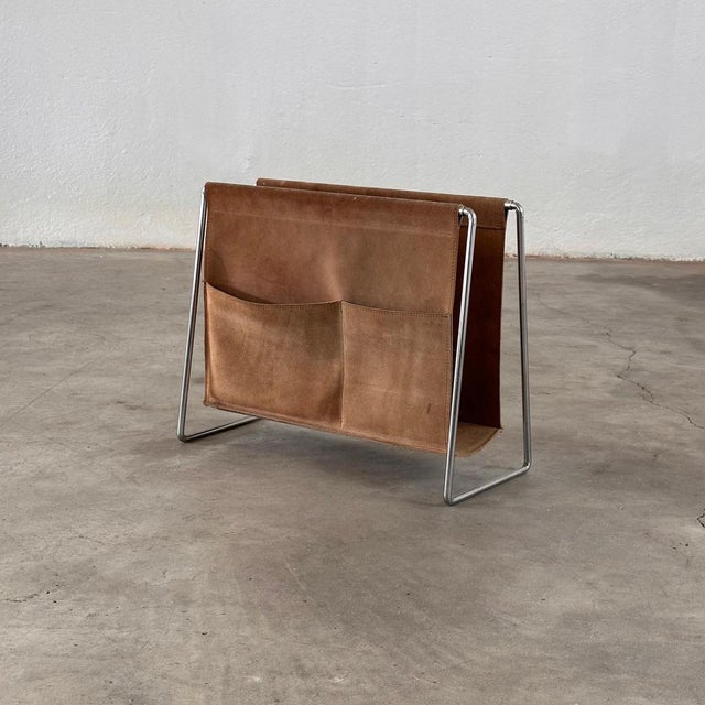 Elevate your living space with a piece of mid-century Danish design history - the "Bachelor" Magazine Rack by renowned...