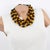 This stunning Angela Caputi resin choker beaded necklace, made in Italy, features a fruit salad multi-strand design with...