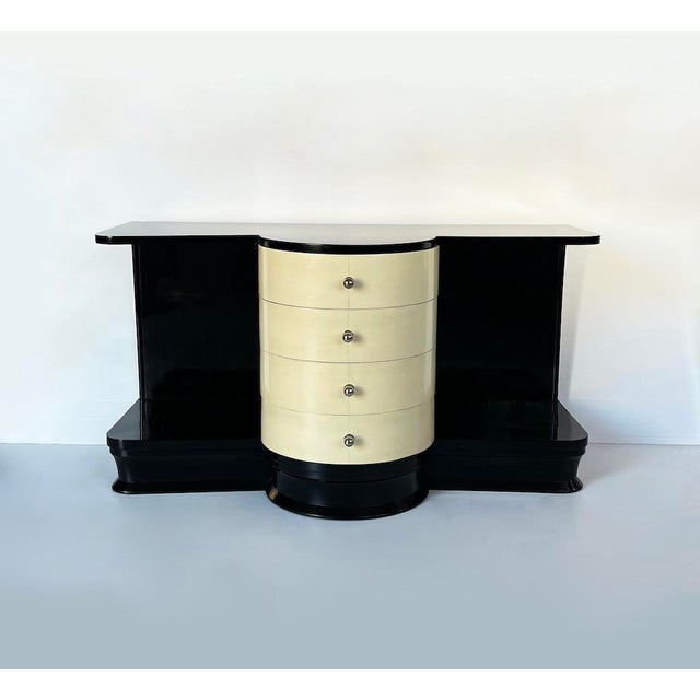 A distinctive 1930s art deco chest of drawers/sideboard, entirely made of black lacquered wood and parchment, suitable for...