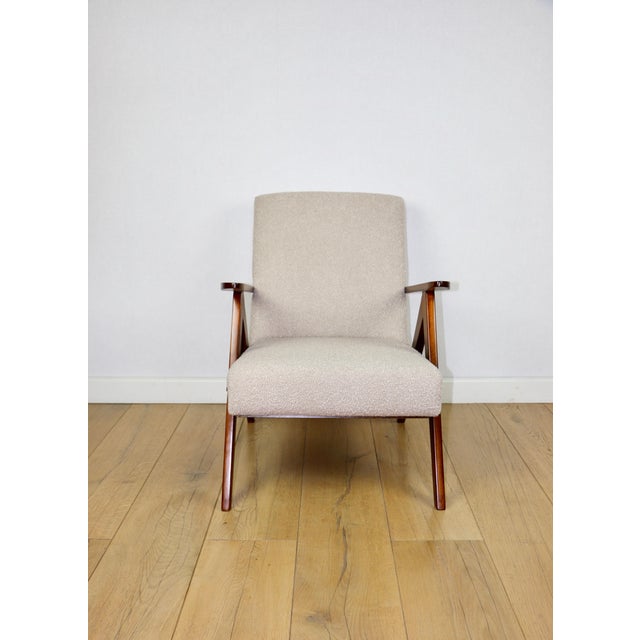 Vintage armchair b-310 var in beige structural boucle from the 1970s, with beech-coloured wood. unique var b-310 armchair...