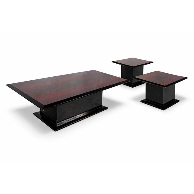 A striking mid-century space age coffee table set, consisting of one large coffee table and two matching side tables. The...