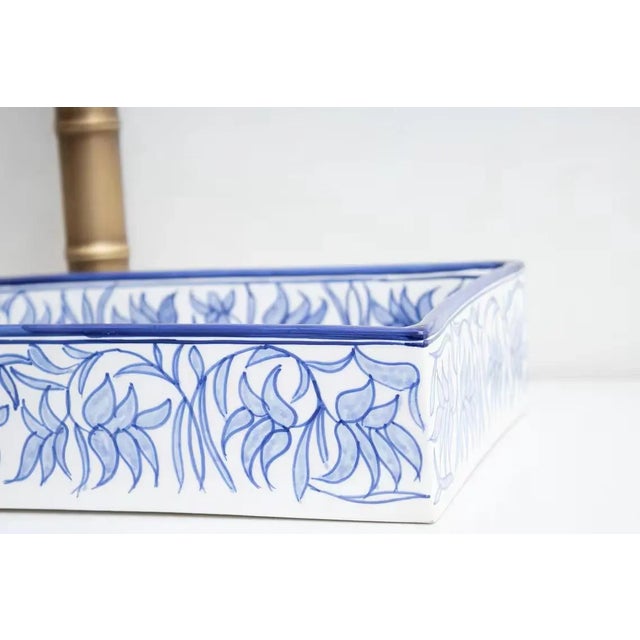 Rectangular ceramic washbasin with blue hand painted floral pattern for bathroom vanity. Perfect for small vanity unit and...
