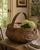 A generously scaled late-19th-century gathering basket, handwoven from narrow oak splints around a sturdy fixed bentwood...