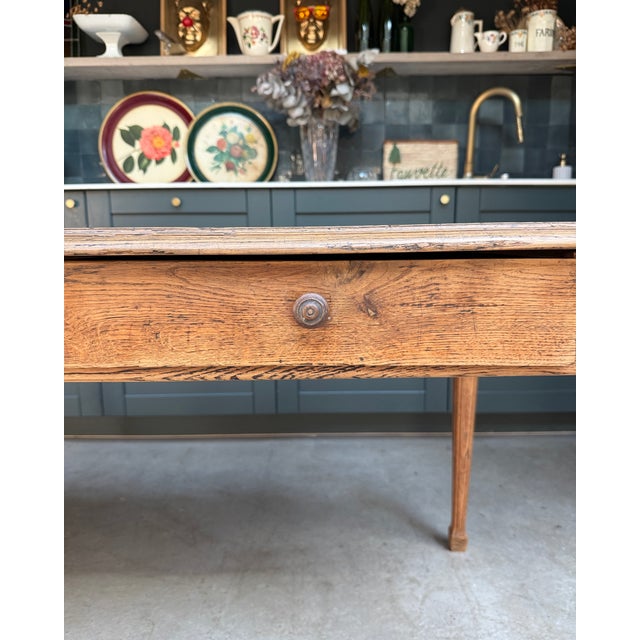 This restored antique farmhouse table captivates with its balanced proportions, simple lines, and the warmth of its light...