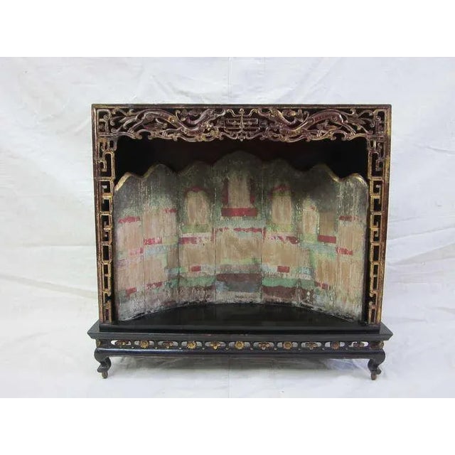 Rare 19th century Shrine Black lacquer with stage back panel painted as theater. Intricately carved detail of double...