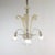 This beautifully handcrafted mid-century gold-infused Cristallo Murano chandelier features three scroll arms with lily-...