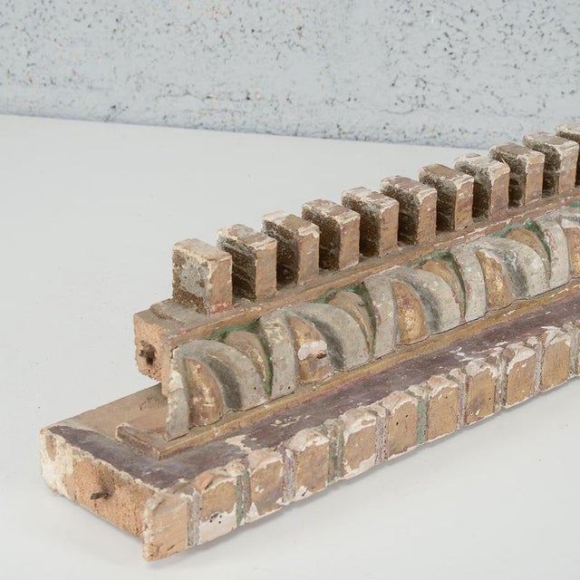 A refined fragment of a vintage carved wooden frame, a fascinating example of classical architectural decoration. This...