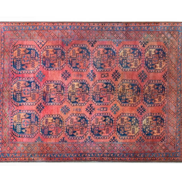 This early 20th-century Afghani Ersari rug is a striking example of tribal craftsmanship, featuring an all-over pattern of...