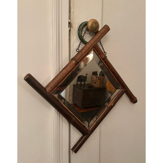 Charming 1930’s Faux Bamboo Beveled Mirror. Carved wood frame evoking bamboo canes. Beautiful patina. Original hanging...