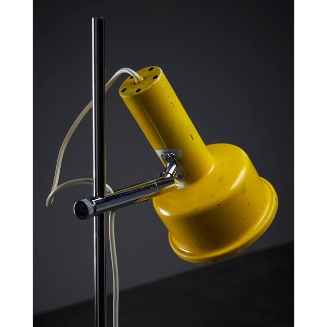 Postmodern Yellow & Chrome Adjustable "Hat" shade floor lamp from the 1970s. An example of Postmodern design, this piece...