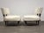 A pair of mid century modern white and mahogany color oversized lounge chairs with brass ferrules. Minor wear to original...