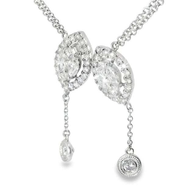 This stunning 14K white gold diamond lariat cluster station pendant slide is a true statement piece. Featuring an array of...