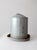 A vintage galvanized chicken feeder with a classic cylindrical form, fitted lid, and wide tray base, finished in a soft...