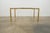 This vintage mid century dining table showcases a striking faux bamboo design, a hallmark of Hollywood Regency and mid-...