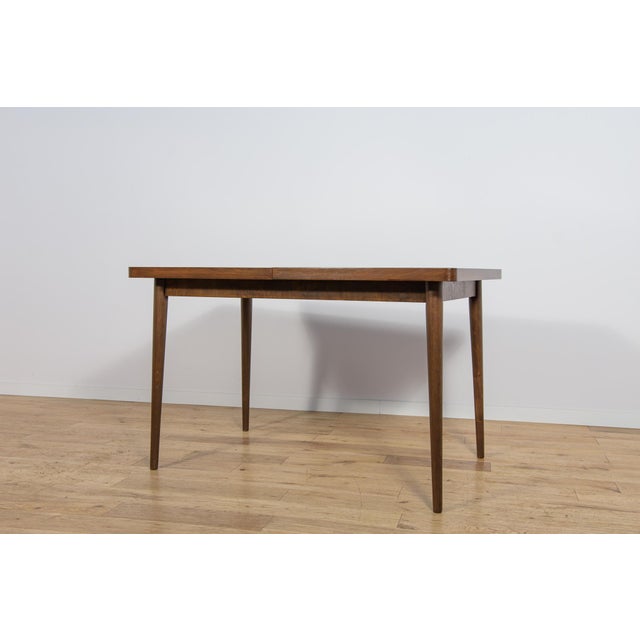 This extendable table was designed by Bohumil Landsman and Hubert Nepozitek in the 1960s. It was manufactured by the...