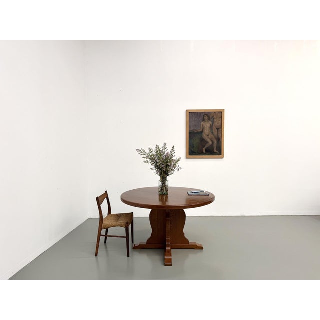 Brutalist round table from the 1960s, crafted from solid oak in the style of Maison Regain and the rustic French furniture...