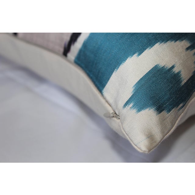 Bohemian silk ikat pillow with vibrant colors of red, beige and blue. Super hand soft. Pillow has a zipper for closure....