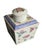 A gorgeous early 1900s footed porcelain tea caddy in the shape of a diamond. The top on caddy with a Greek key design in a...
