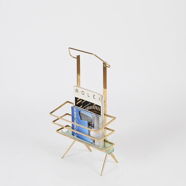 Stunning Mid-Century Italian magazine rack in solid brass and perforated enameled light green metal. This incredibly...