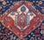 An incredible late 19th century Persian Ghashghaei rug with two large crimson and indigo diamond medallions amidst a...