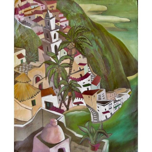 The architecture climbs with an almost cheerful determination, white buildings stacking upward toward a church tower at...