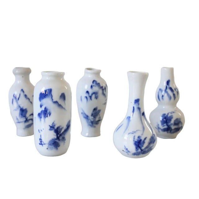 Set of five vintage Chinese blue and white porcelain bud vases. No makers mark. Minor age wear. No chips.
