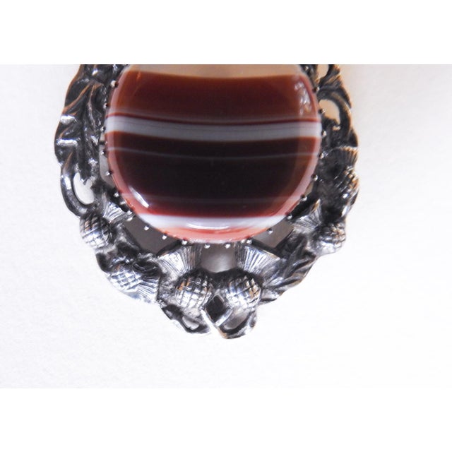 1956 century Glasgow Scotland sterling silver and with bezel set banded agate and thistle brooch. Stamped on back, maker...
