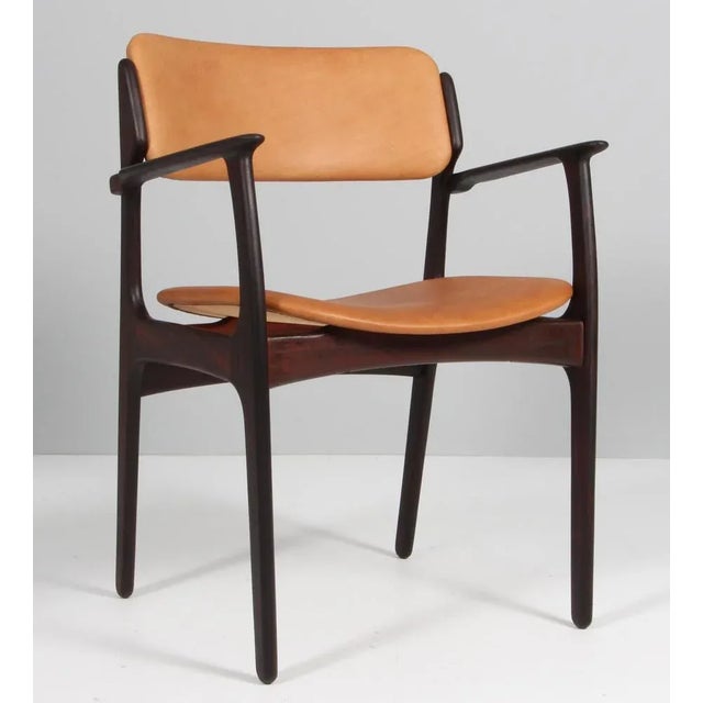 Erik Buch armchair frame of rosewood. New upholstered with vintage tan aniline leather. Model 50 made by Odense...