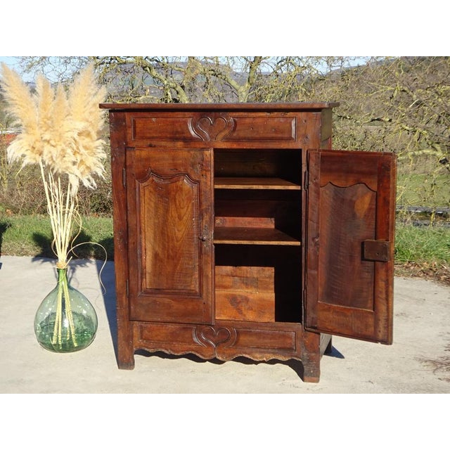 A very old wedding sideboard, entirely in solid walnut, traditionally made in France at the end of the 18th century....