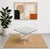 A striking sculptural coffee or side table featuring a thick square glass top resting on an architectural Lucite base....
