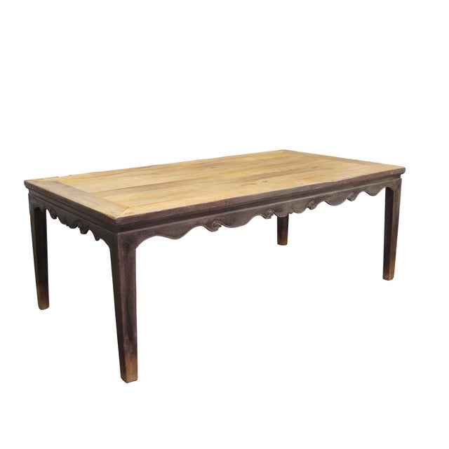 This square dining table is built from solid elm, featuring a square-corner construction. The tabletop showcases a...
